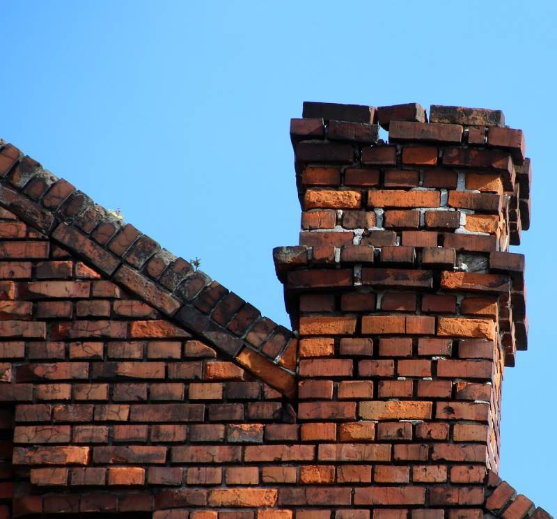 Damaged chimney on an Wenham home showing cracks and missing mortar